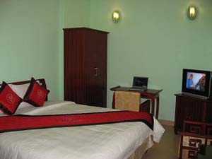 Standard single with city view, balcony, private shower shared toilet, and breakfast